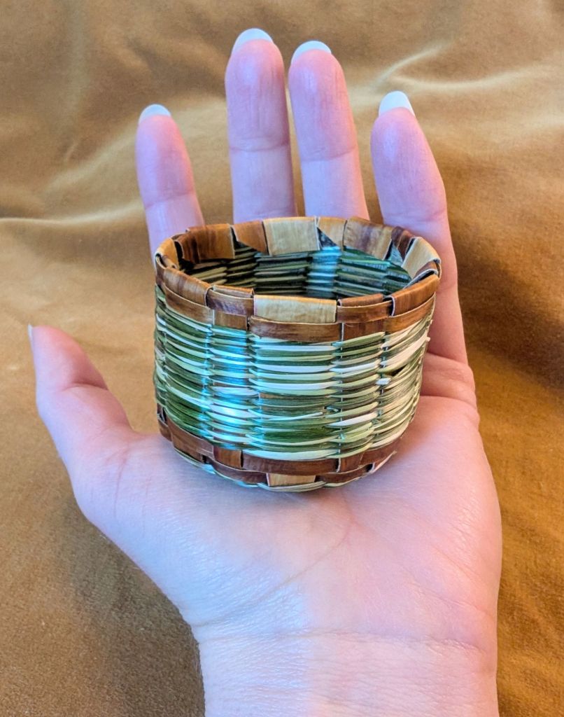 Photo of the basket with the spokes folded down to make a temporary top edge.
